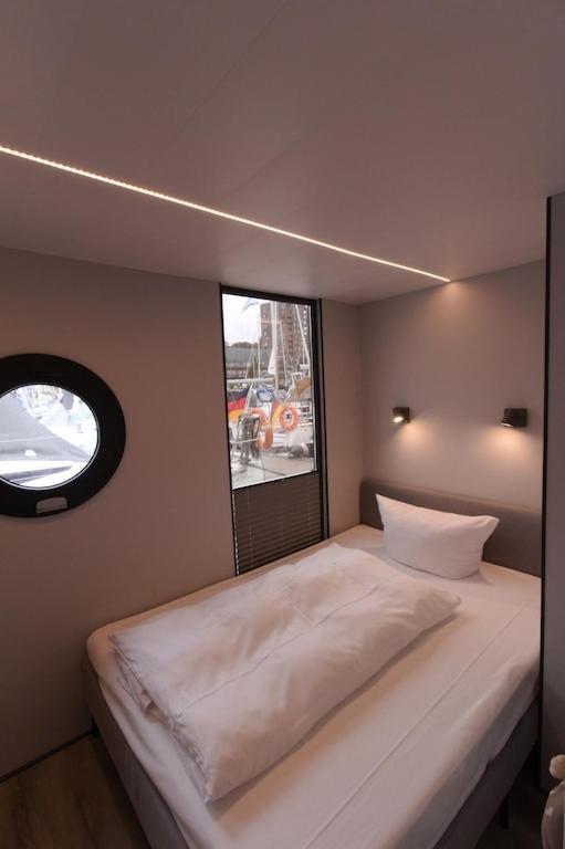 Hausboot Fjord Meeresbrise Mit Dachterrasse In Flensburg Bagian luar foto